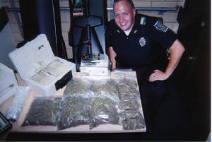 Drug cop with his haul